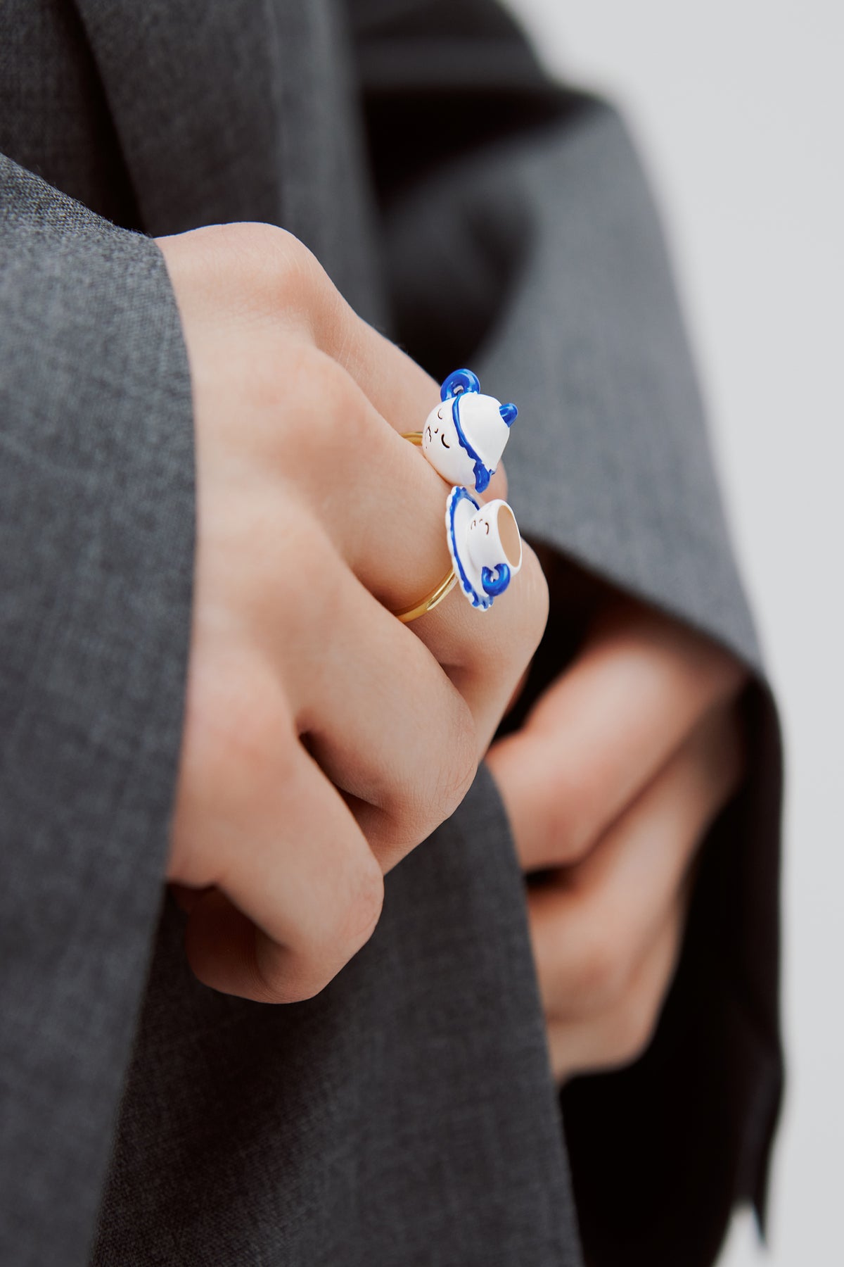 Adjustable ring with blue and white teapot and yellow rhinestone