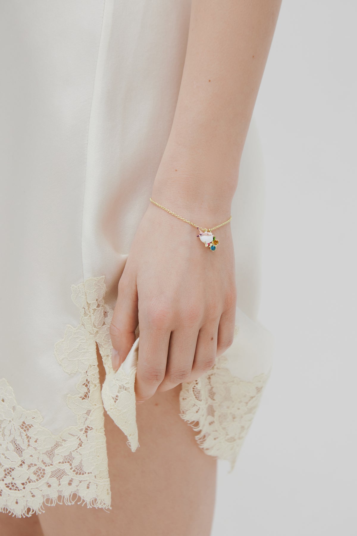 Pendant bracelet with snow bunting, rosebud and crystals