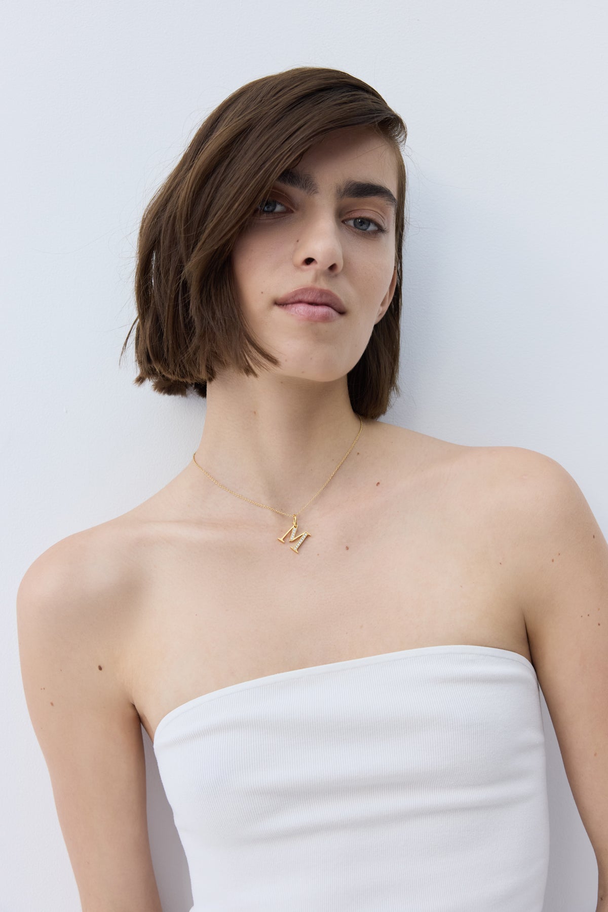 Gold letter M pendant with crystals