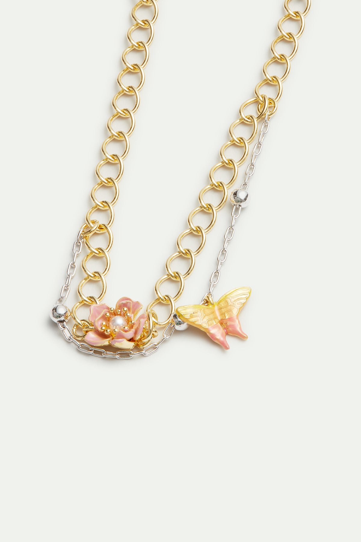 Bracelet double chaine bicolore, fleur de magnolia et papillon