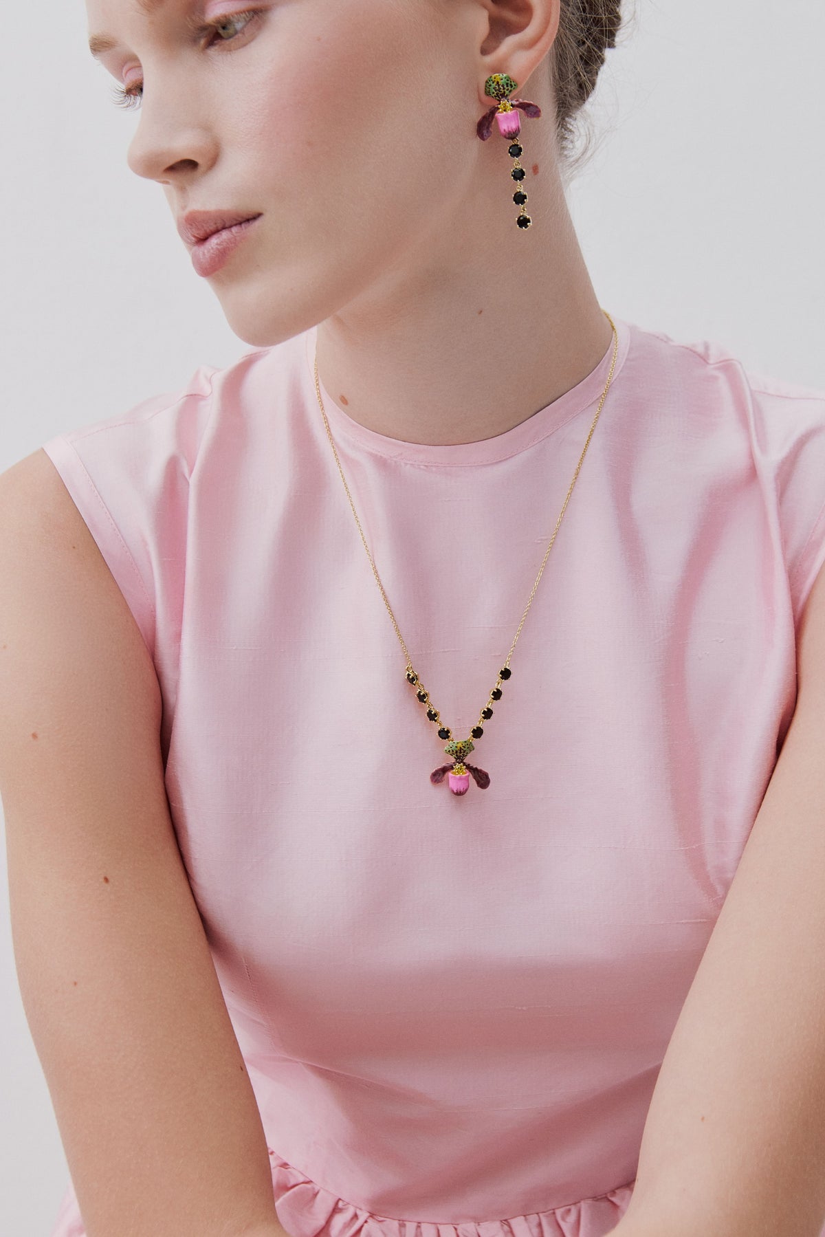 Purple lady's slipper orchid necklace with black faceted glass stones
