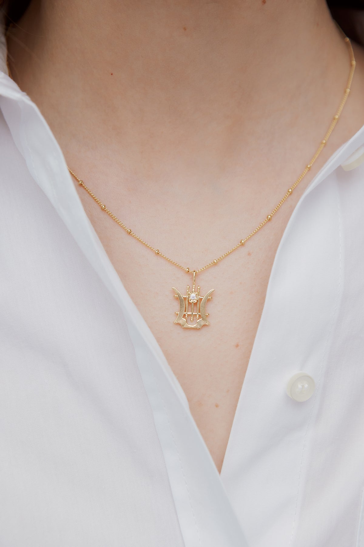 Collier pendentif Lyre doré