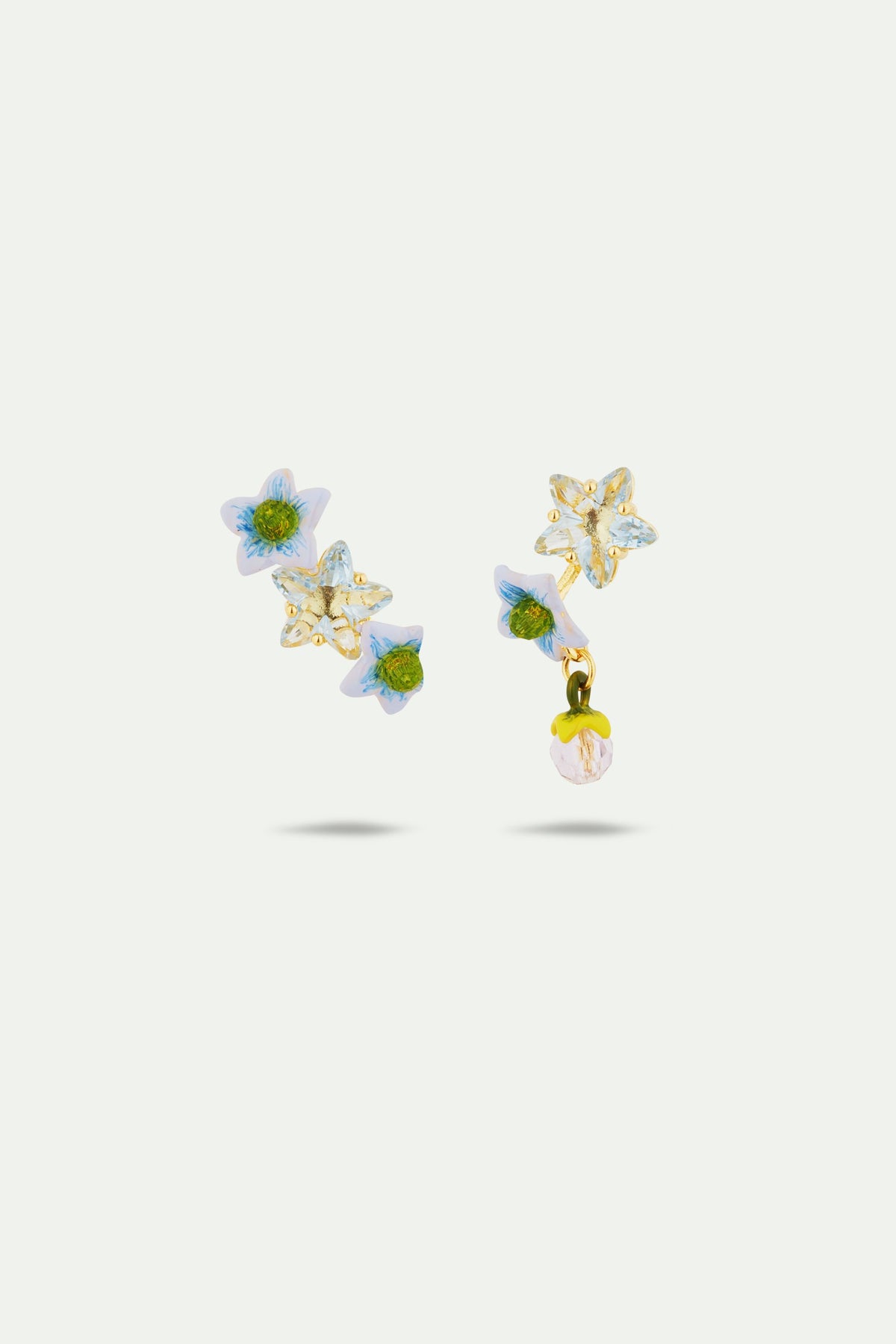 Asymmetrical faceted star and jasmine flower Post earrings
